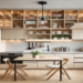 A modern, compact kitchen featuring space-saving designs, including open shelving, a foldable dining table, slim kitchen island, and under-cabinet lighting, creating a functional and stylish space