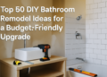 A partially renovated bathroom with white subway tiles, modern fixtures, and tools scattered on the floor, showcasing a budget-friendly DIY bathroom remodel.